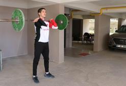 Milli atlet Doğukan Kilcioğlu, apartmanın garajında formunu koruyor